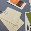 Etiqueta de Papel Kraft para Ropa de Fábrica Original Personalización Etiqueta Hot Stamping Impresión en Color UV Banda Anti-Manipulación Etiqueta Colgante Personalización