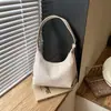 Bolso tejido bajo el brazo para mujer, nuevo modelo 2026, bolso de hombro y cruzado con un toque de alta gama, bolso de media luna versátil con un diseño único