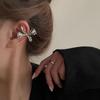 Pendientes de lazo de metal tridimensionales con diseño de nicho 2024, pendientes de moda para viajeros con diseño de viento frío de alta calidad