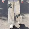 Conjunto de dos piezas nuevo estilo universitario para primavera y otoño para niñas, con un top tipo dos piezas con diseño de patchwork y pantalones retro, chic y casual