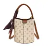 Bolsa de mão feminina de luxo, novo modelo 2026, bolsa saco com monograma estampado mãe-filha, versátil para usar no ombro, transversal e como bolsa de mão para vendas transfronteiriças