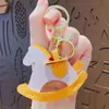 Llavero colgante de cuero de dibujos animados creativos, caballo de Troya pequeño, colgante para bolso de pareja, llavero de coche, regalo, venta al por mayor