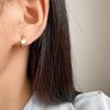 Exquisito pendiente de circonita sin agujero en la oreja de una pieza con clip para la oreja tipo plato de incienso de mosquito simple y combinable pendientes para mujer pendientes de aguja de plata al por mayor