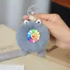 Chaveiro de Pelúcia com Rosto Sorridente e Flor Colorida Boneca Bola de Pelo Fofa Pingente para Bolsa Mochila Carro