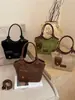 Bolso de mano de mujer de alta gama, nicho, estilo vintage, de importación, nuevo bolso de hombro de moda 2026, bandolera tipo cubo versátil