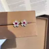 Nuevos Pendientes de Flor Pequeña Polvo de Flor Diamante Flor para Mujer Diseño de Nicho Modernos Dulces Elegantes Populares Pendientes de Fiesta