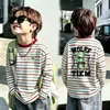 Camiseta a rayas estampada versátil y elegante para niños, manga larga, 2026 primavera y otoño, corte holgado, camiseta básica versátil para niños mayores