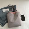 Bolsa balde drawable de cor contrastante feminina 2025 nova moda primavera e verão grande capacidade simples casual bolsa de ombro bolsa de trabalho
