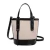 Bolso cubeta de colores contrastantes popular de este año para mujer 2026 nuevo bolso de mano de moda nicho bolso de hombro sensación de alta gama bolso cruzado