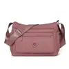 Bolsa de maternidad multicapa de nailon, elegante y simple, impermeable, moderna y versátil, bolso cruzado casual y ligero de nailon