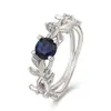 Deseo una venta caliente nuevo anillo de compromiso de hoja de olivo de princesa europea y americana anillo de diamante azul anillo de diamante joyería al por mayor