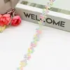 En stock 1.3cm colorido poliéster siete pétalos flor pequeña pasamanería, accesorio para decoración de zapatos y sombreros, pasamanería decorativa