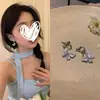 Pendientes de metal con circonita y mariposa de cristal azul para mujer, de alta gama, con personalidad de hada, elegantes y a la moda que combinan con todo.