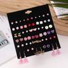 Yiwu Joyería para Orejas al por Mayor Crisantemo Rosa Corazón Mariposa Borla Letras Conjunto de Pendientes Pequeños Frescos Femenino Transfronterizo