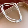 Collar largo de perlas irregulares, estilo de lujo ligero francés, cadena para suéter, joyería de nicho minimalista de alta gama al por mayor para mujer