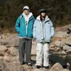 Ropa de Abrigo de Algodón con Capucha Empalmada Falsa de Dos Piezas Suelta Estilo Hong Kong Invierno 2024 para Hombres y Adolescentes Ropa de Abrigo de Algodón Engrosada de Moda para Hombres