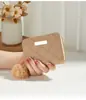 Bolsa para Monedas Casual y Sencilla para Mujer 2026 Nuevo Modelo Patrón de Rombos Pompón Pequeño Tarjetero Personalizado de Moda Bolsa de Comercio Exterior Lujo Ligero
