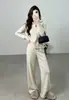 Conjunto de Punto de Dos Piezas para Mujer con Diseño de Textura Hueca de Nuevo Estilo Transfronterizo Europeo y Americano, Cárdigan con Solapa y Doble Cremallera, Pantalones de Pierna Ancha