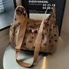 Bolsa de Lona Feminina Outono Inverno 2026 Nova Pequena Design de Nicho Bolsa de Ombro Único Transversal Estilo Coreano Casual Popular Este Ano Bolsa Tote