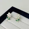 Pendientes de flor de diamante dorados que gotean aceite para mujer, temperamento dulce, orejas delicadas, nicho, pendientes de alta gama, venta al por mayor