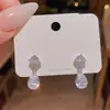 Pendientes de circón brillantes, de lujo ligero, de nicho, de alta gama, exquisitos para mujer, modernos para ir al trabajo, con colgante de gota de agua, accesorios para la oreja