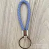 Llavero de cuerda de cuero trenzado simple creativo colgante de muñeca linda accesorios de llave para parejas tendencia regalos pequeños venta al por mayor
