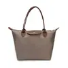 Bolso de mujer transfronterizo simple y elegante, bolso de hombro de gran capacidad, bolso de mano de viaje, bolso tote, bolso de axila de color liso de nicho