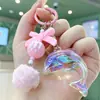 Llavero de Delfín Láser de Moda con Bola de Felpa Linda y Lazo, Colgante para Bolso para Niñas, Accesorio para Llaves de Color Soñador