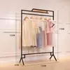 Perchero moderno simple de piso estante multicapa simple estante para ropa de mujer soporte de exhibición de ropa de hierro venta al por mayor