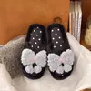Chinelos de algodão confortáveis estilo coreano com laço, chinelos de pelúcia para casa e para usar ao ar livre outono e inverno 2026 para mulheres