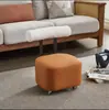 Taburete pequeño de rueda universal estilo chino para el hogar, sala de estar, cuero de alta gama, taburete bajo silencioso con respaldo, taburete deslizante, taburete bajo