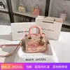 Bolsa de caramelo de encaje hueco rosa de una generación 2024 bolso de mano de alta calidad para el día a día al por mayor