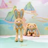 Jinnew Original Nuevo Estilo Chino Divertido Colgante de Peluche de Conejo Desplegable Llavero de Conejo de Orejas Tirables Muñeca Venta al por Mayor