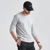 Camiseta Masculina de Manga Longa Outono Coreana Gola Redonda Tamanho Grande Camiseta Básica Cor Sólida Moda Primavera e Outono Camiseta Top