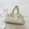 Bolsa vintage de gran capacidad, nuevo modelo verano 2026, alto valor estético, bolso de hombro de color sólido, bolsa de mano casual para el trabajo y los desplazamientos