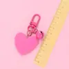 Nuevo llavero Bell love colgante lindo color resina corazón de durazno accesorios pequeño fresco adornos de corazón de durazno