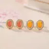 Pendientes Yilu de Plata de Ley S925 Chapados en Oro Ámbar Rojo Agua Rojo del Sur Moda Simples Elegantes Facetados Versátiles Joyería de Plata