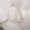 Amazon Transfronterizo Moda Elegante Conjunto de Collar y Pendientes de Perlas de Imitación para Mujer Francés Nicho Conjunto de Joyería de Alta Gama