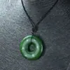 Venta al por mayor de fábrica imitación jade Hetian patrón antiguo hebilla de seguridad colgante material de Mongolia Exterior patrón de dragón verde espinaca anillo plano de jade
