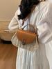 Bolso de paja tejida para mujer, diseño de nicho, nuevo bolso bandolera de primavera y verano 2025, bolso de playa portátil para vacaciones en la playa.