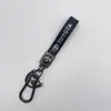 Emblema de Logo Metálico de Alta Gama para Coche Textura de Fibra de Carbono Llavero para Coche Colgante Adorno Regalo Accesorios Decorativos Venta al por Mayor