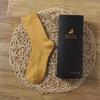 Calcetines de Lana Sin Costuras para Otoño e Invierno para Hombres y Mujeres, de Media Pantorrilla, Cálidos, Una Caja con Colores Aleatorios, Duraderos y Cálidos, Moldeado Integrado para Invierno