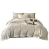 Lujoso y elegante juego de cama de cuatro piezas de algodón de grado A, con un diseño europeo sencillo, colores lisos y adecuado para hoteles.