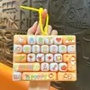 Llavero creativo para aliviar el estrés de animales pequeños, juguete divertido para estudiantes, colgante de teclado mecánico de 26 teclas, venta al por mayor de regalos