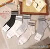 Calcetines de Longitud Media Kaisen Otoño e Invierno Nuevos para Mujer Estilo Coreano Rayas Verticales Gris Moda Retro Versátiles Calcetines Holgados