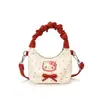 Bolsa de mão de gato doce e fofa estilo coreano, uma bolsa transversal mini e única para mães e filhas, apresentando um design plissado e um toque moderno, leve e luxuoso