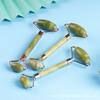 Traje raspador de un solo agujero masajeador dispositivo de rodillo facial instrumento tamaño doble cabeza de Jade venderá regalos rodillo de jade transfronterizo