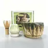 Tazón de té de cerámica texturizado de col blanca tridimensional con pico, emparejado con un soporte para batidor de té del mismo color, múltiples accesorios para la preparación de matcha