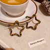 Pendientes Retro Estilo Hong Kong Otoño e Invierno Estampado Leopardo Estrella de Cinco Puntas para Mujer, Estilo Dulce y Fresco Sexy, Pendientes de Estrella de Moda y Versátiles