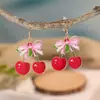 Pendientes acrílicos versátiles y elegantes estilo universitario con lazo para mujer, pendientes de lápiz de nicho para temporada de graduación, lindos y modernos